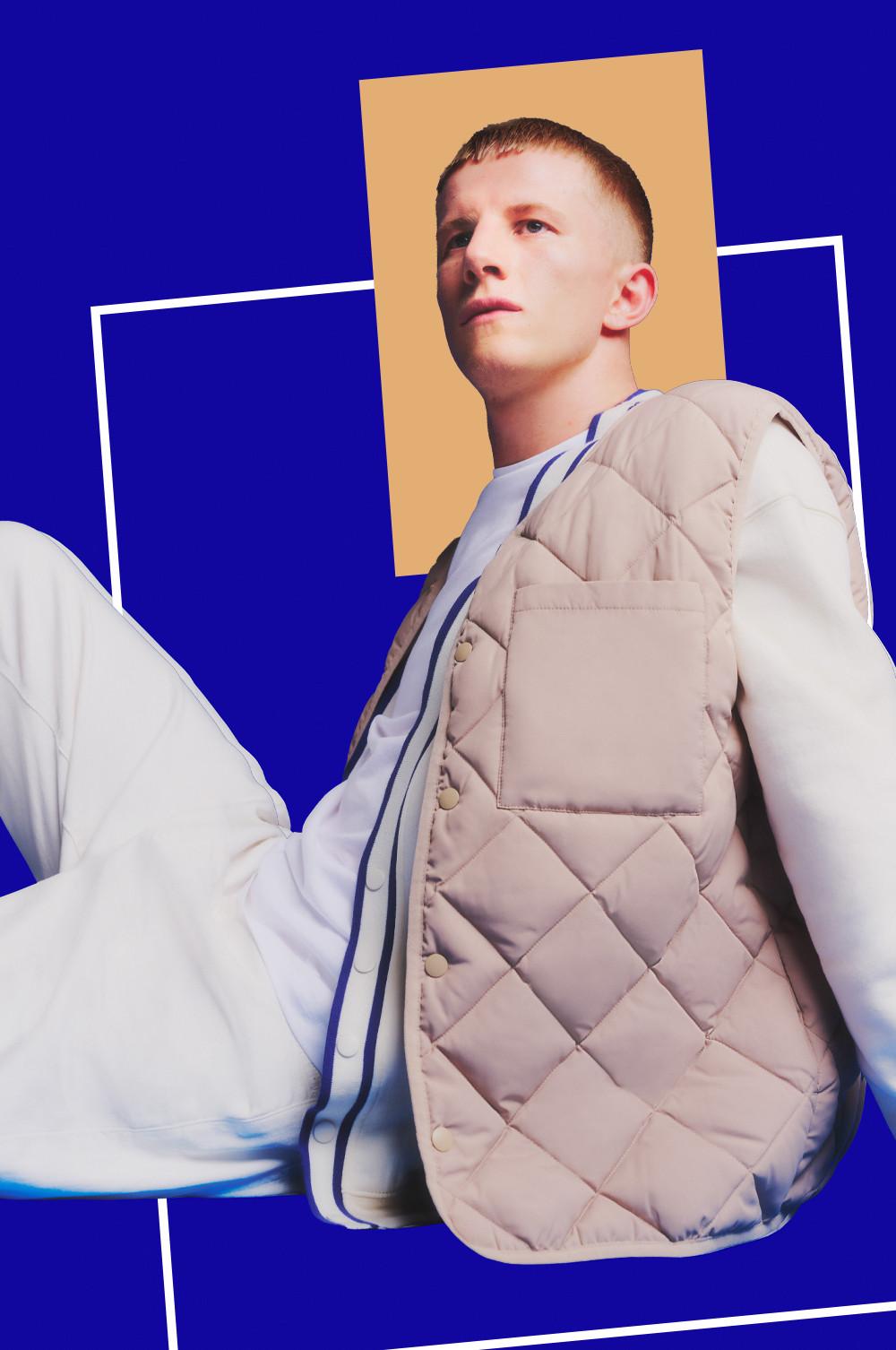 Model in gray tracksuit and cream padded vest