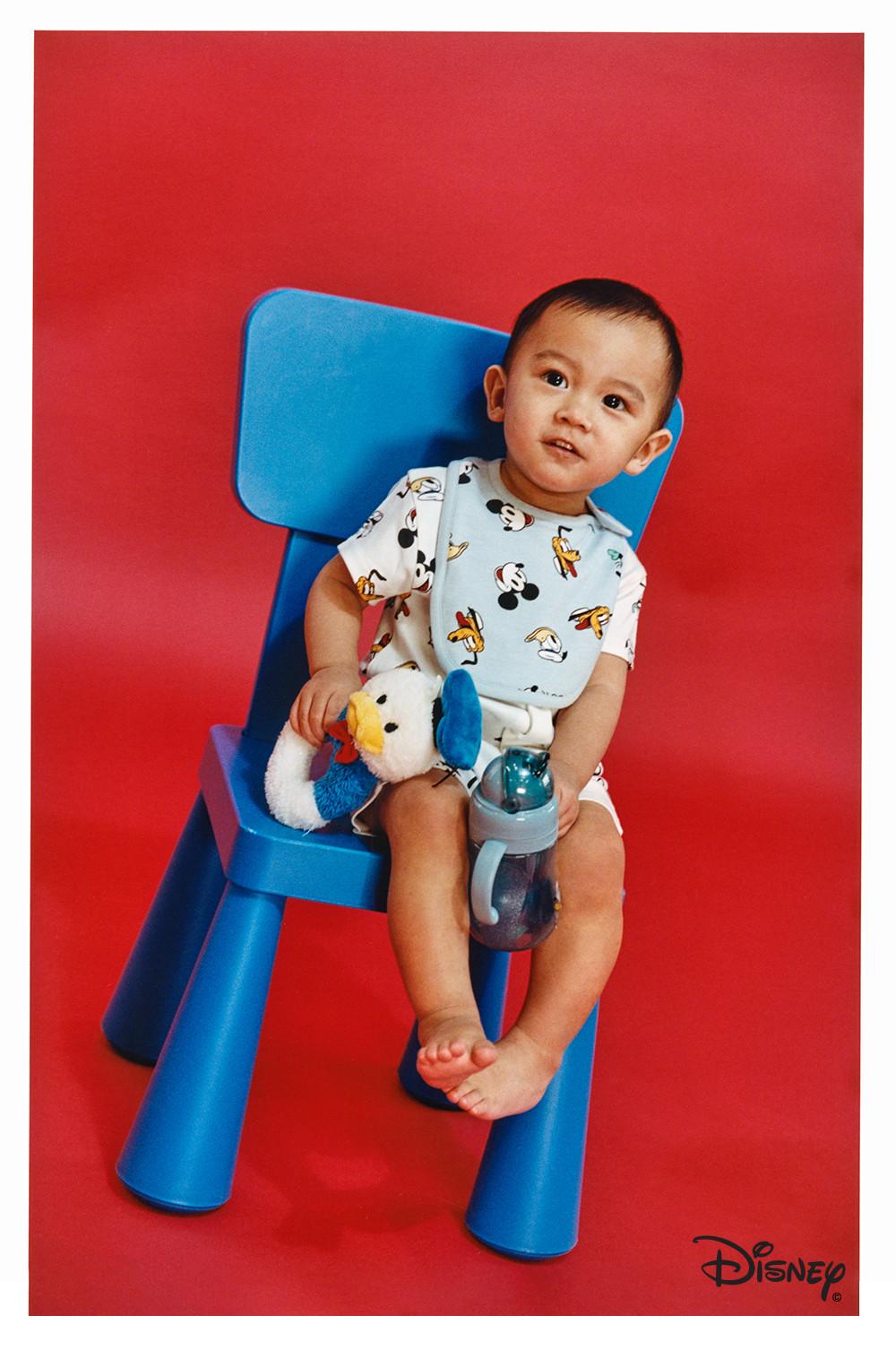 Child in romper with bib