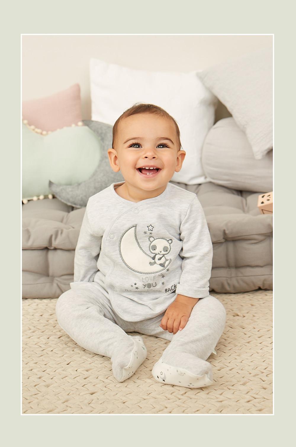 Baby in grey moon onesie