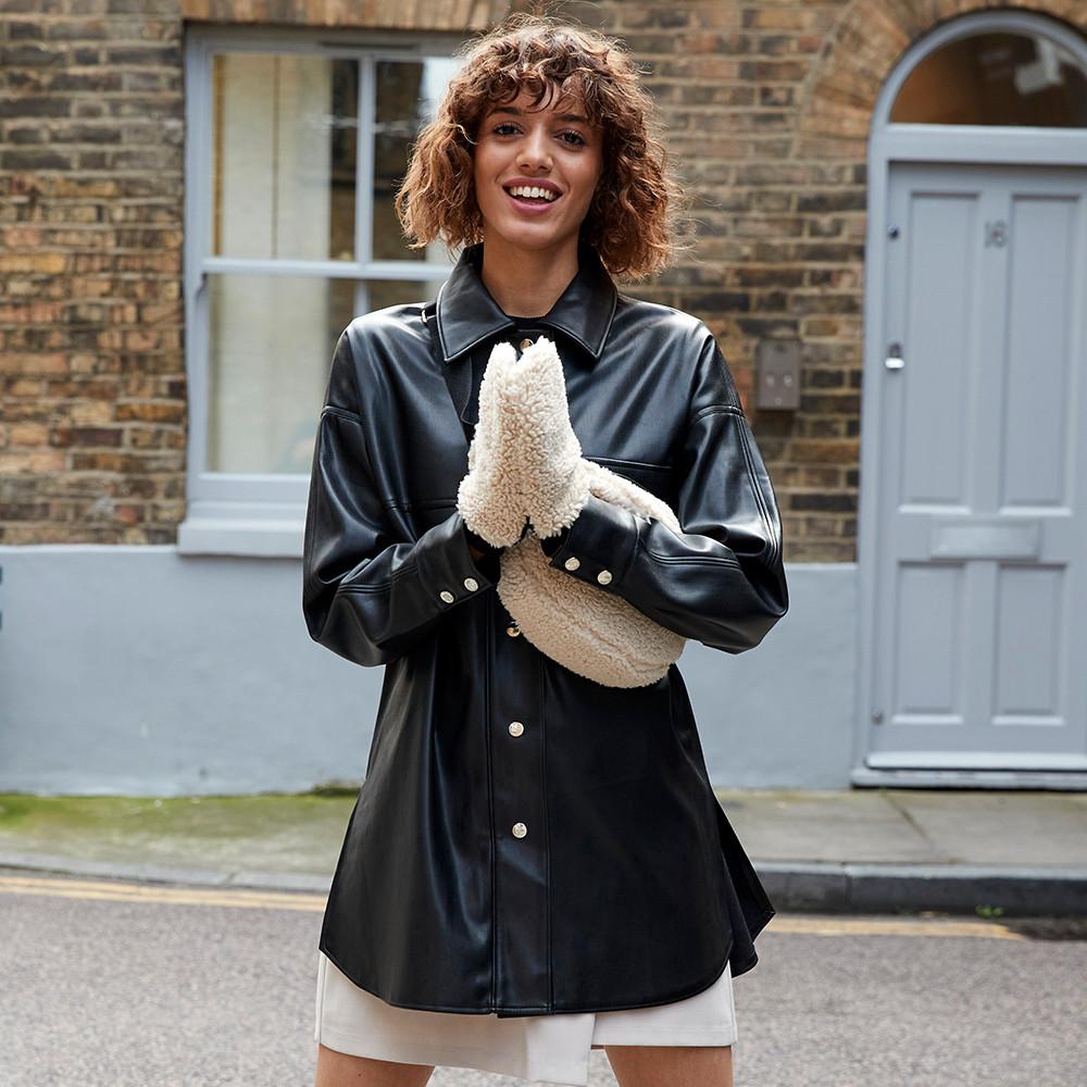 Model wears Borg gloves and bag, paired with a leather look shacket