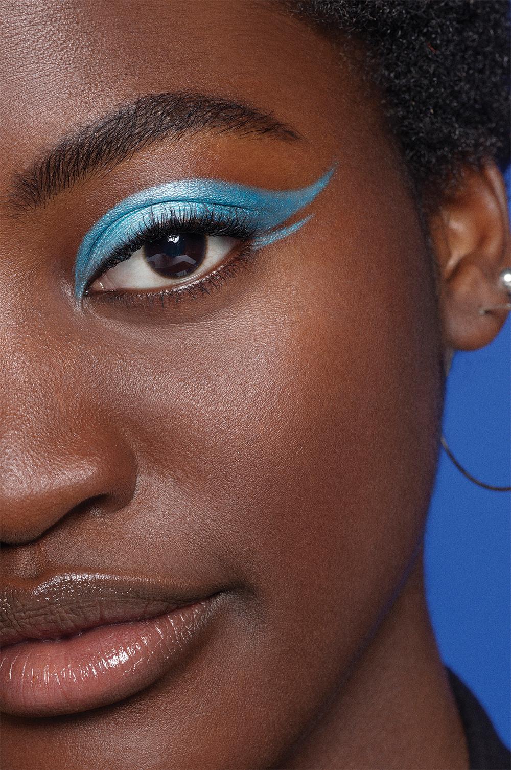 model wearing blue eyeliner