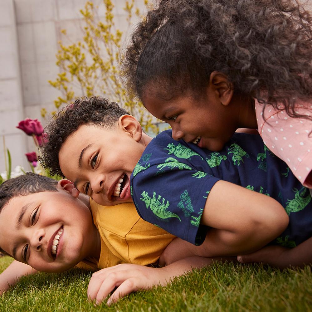 Children playing wearing colourful t-shirts