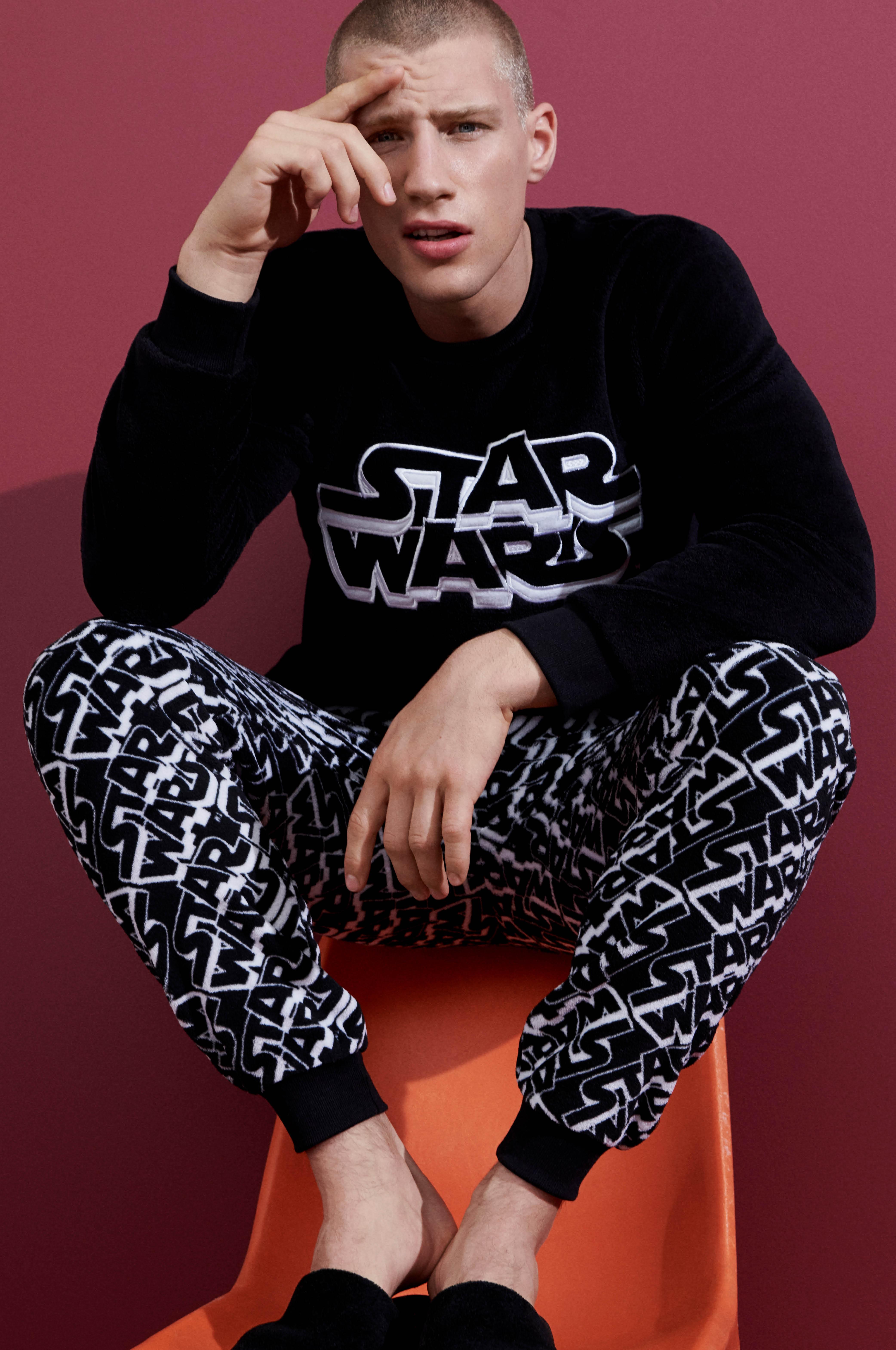 Male in Star Wars pyjamas