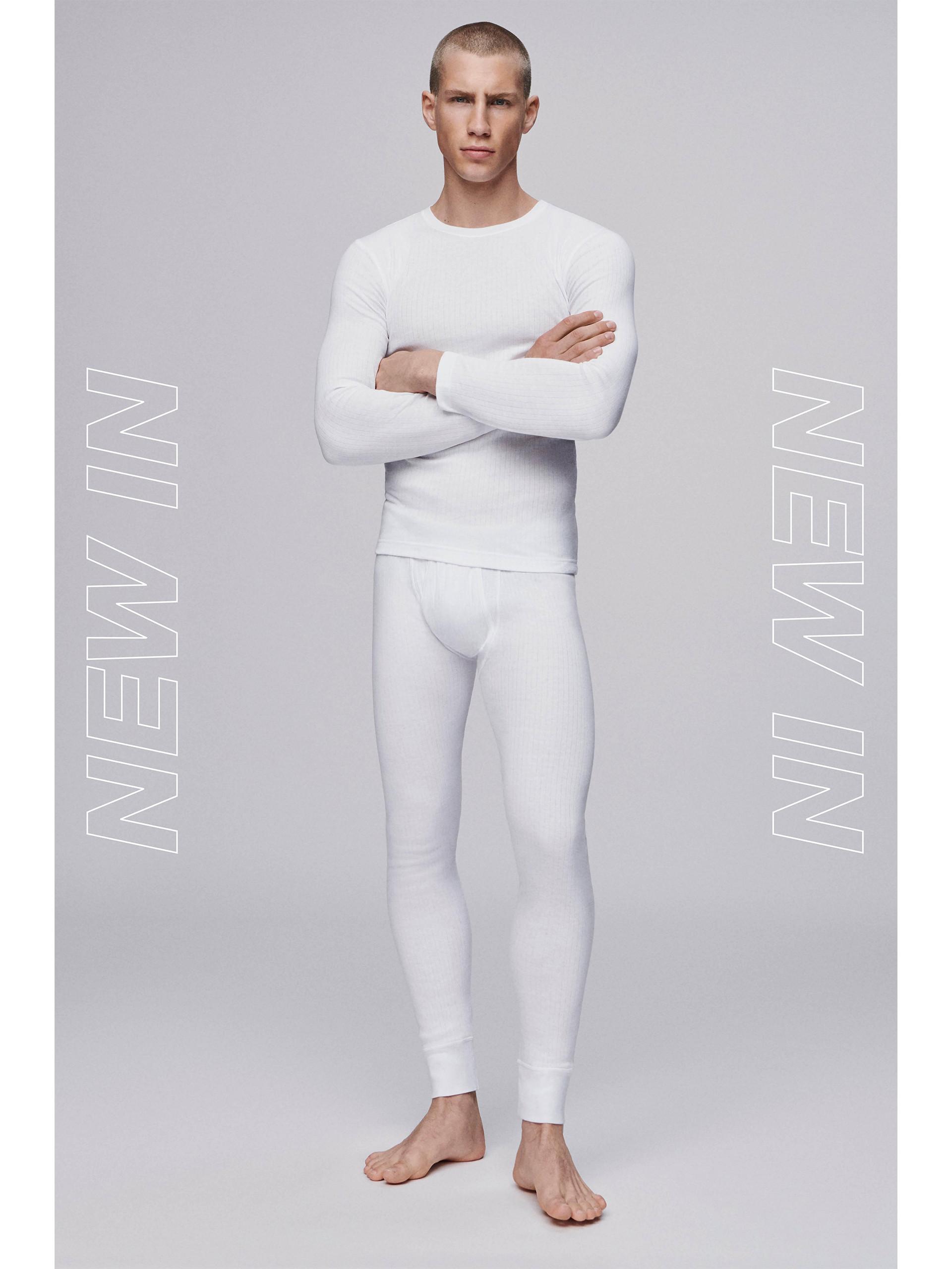 male model in white thermals