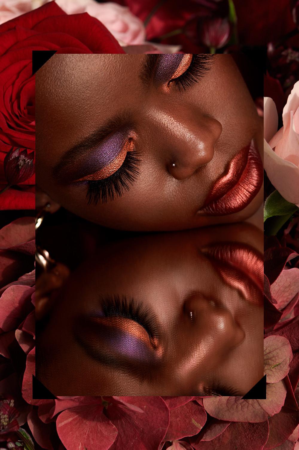 Mirrored image of model in pink and purple eyeshaddow, overlaid on an image of roses
