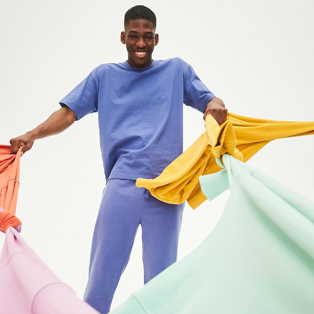 model wears blue jogging bottoms and matching blue top