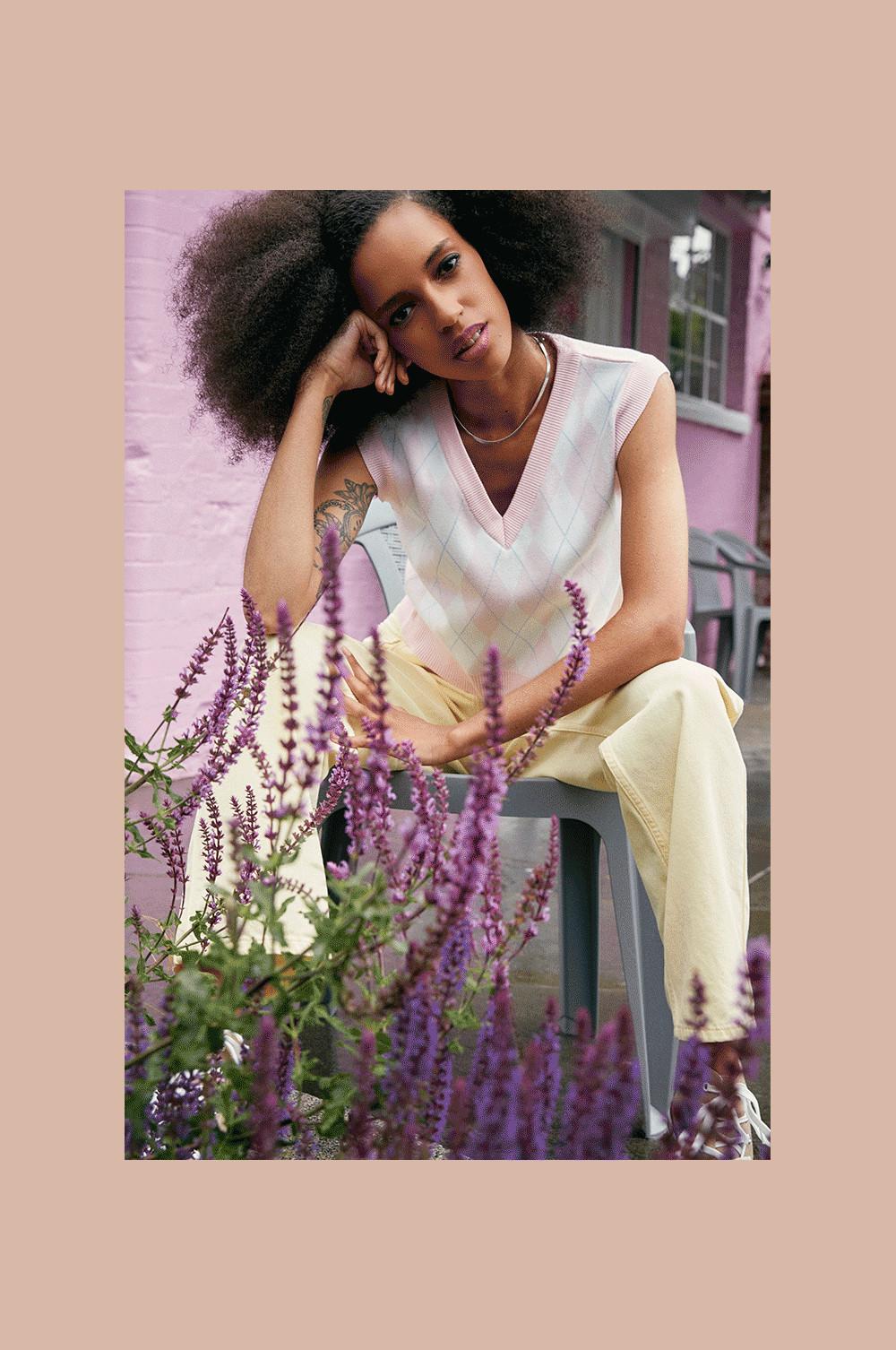 Model wearing Knitted Vest and Yellow Jeans