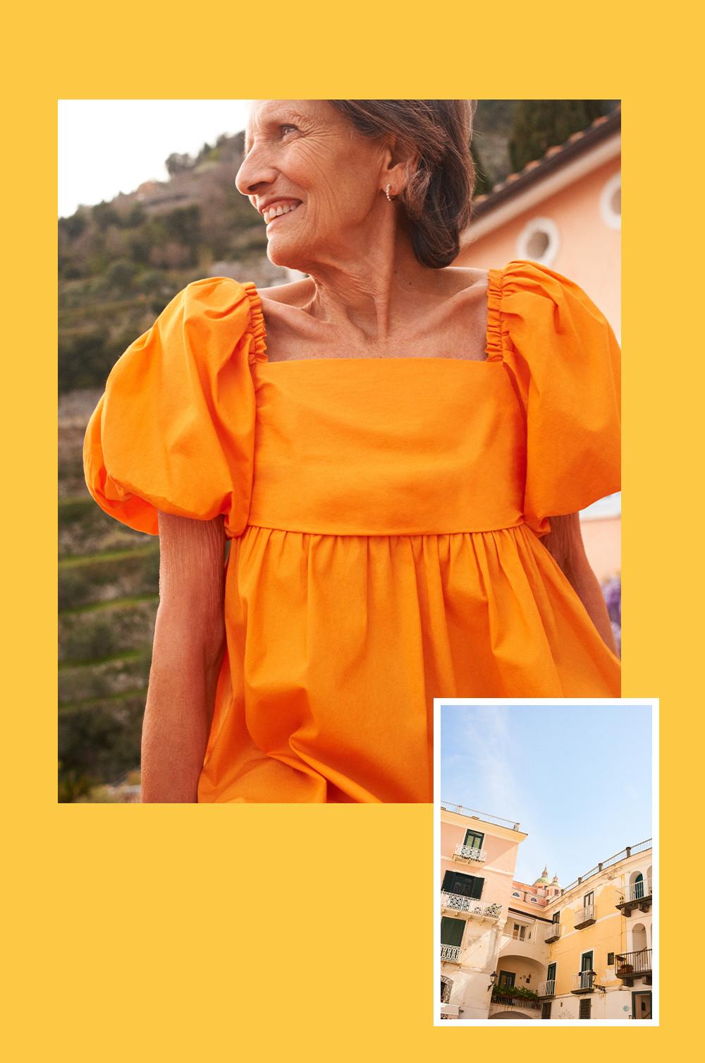 Frau in orangem Popelinekleid mit Puffärmeln