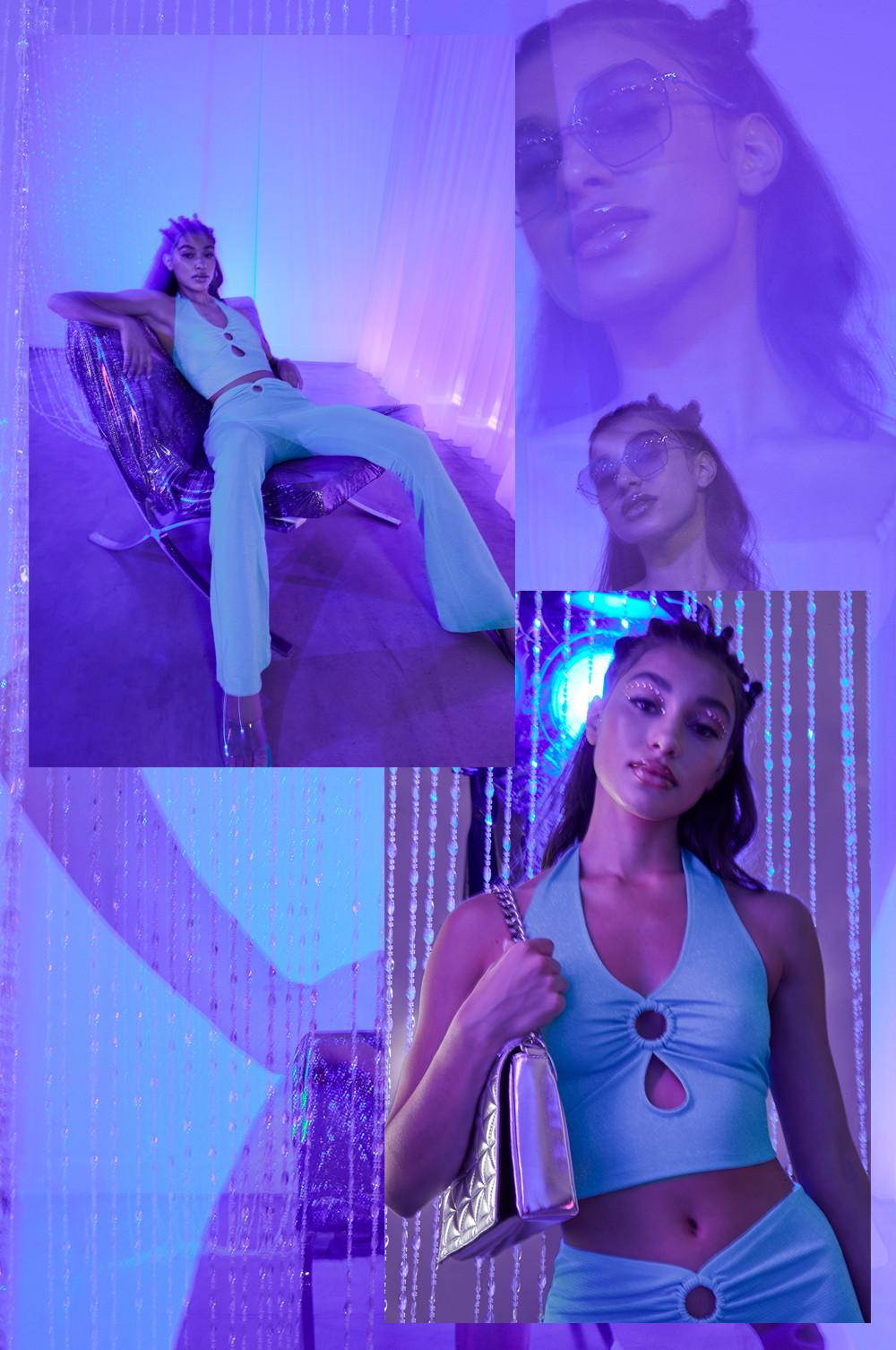 model wears glitter halter-neck blue top with coordinating flares