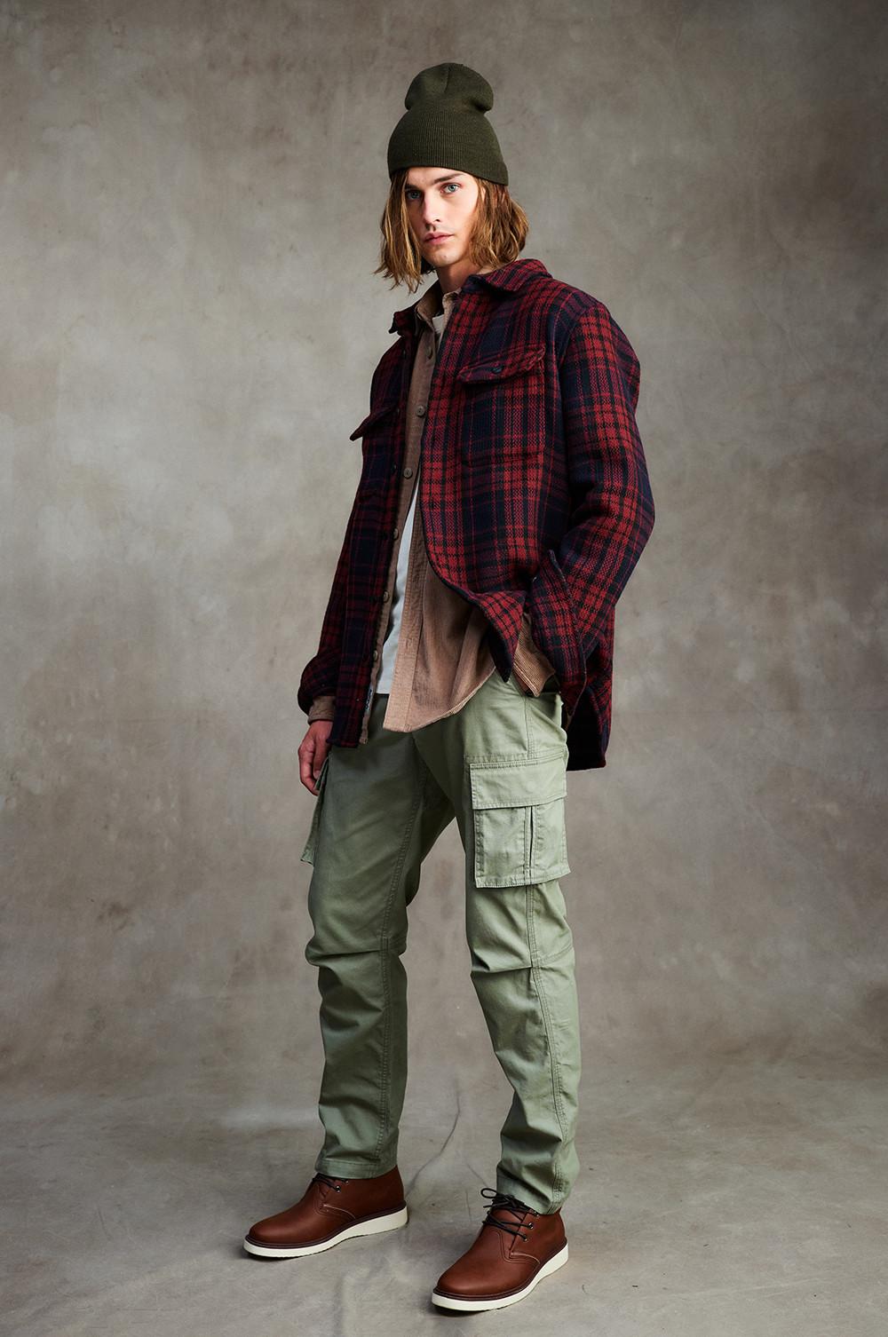 Model wears shacket and cargo trousers