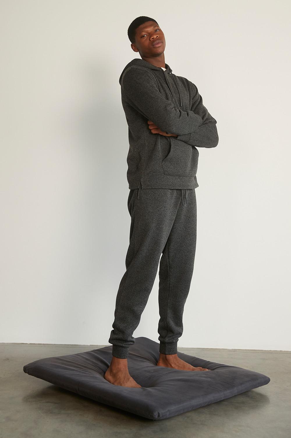 Model wearing dark coloured loungewear