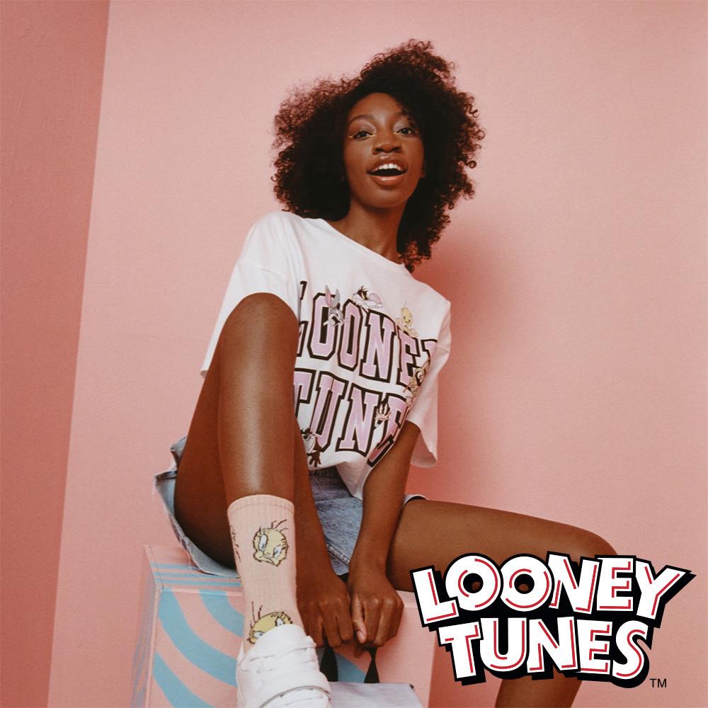 model wears looney tunes oversized tshirt and socks