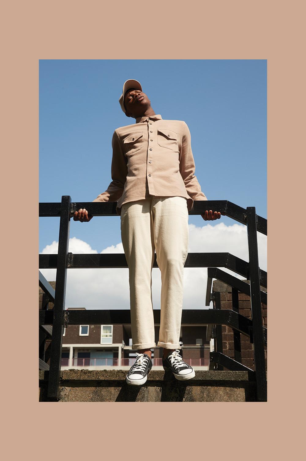 Model wearing light coloured clothing outdoors