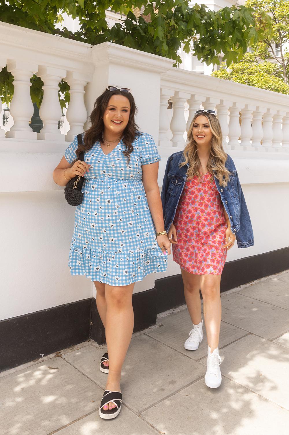 Women wearing mini pink and blue dresses