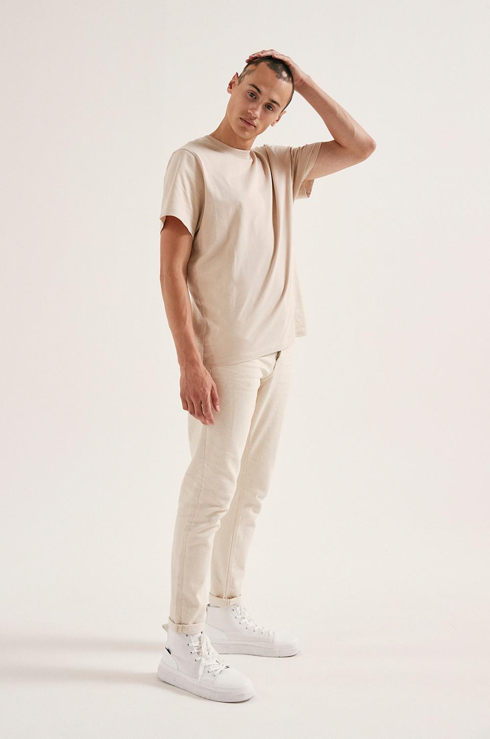 Model wearing Ecru Jeans and Ecru T-shirt