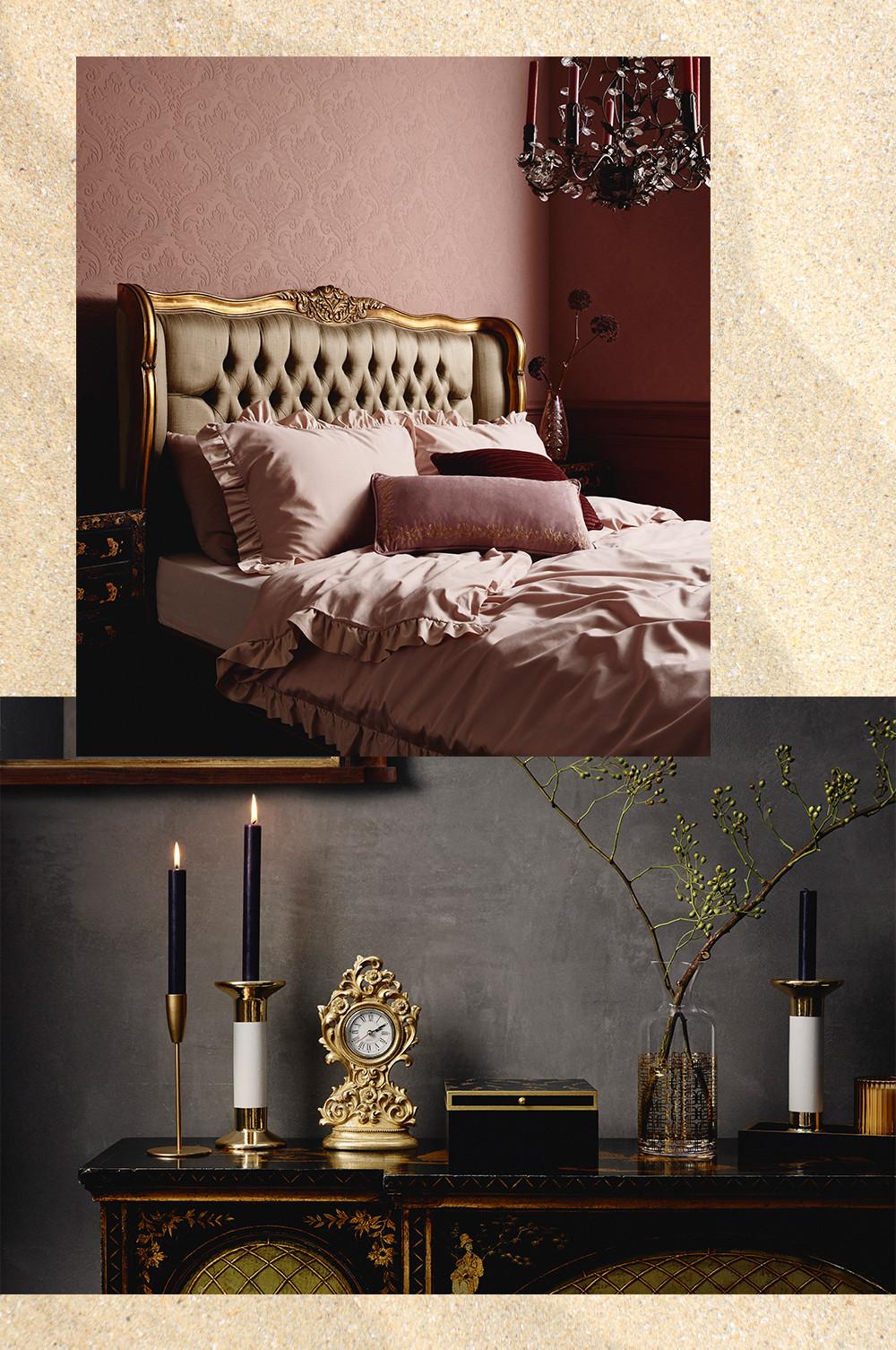 Dormitorio de lujo, ropa de cama rosa, velas y accesorios dorados