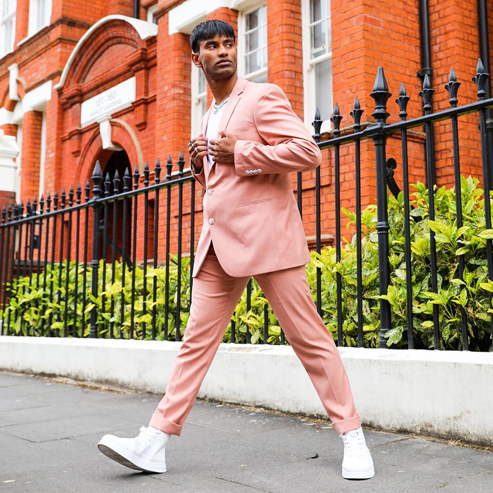 man in pink suit