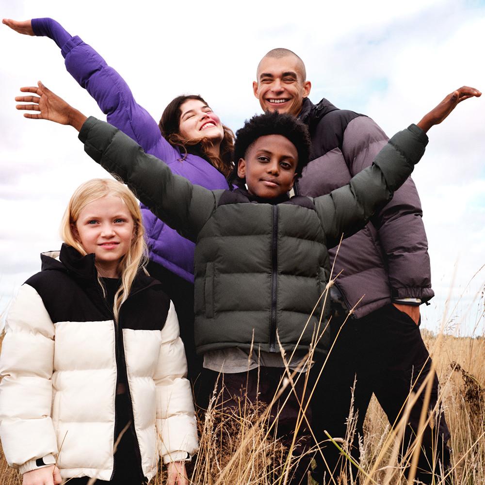 Family in matching puffer coats