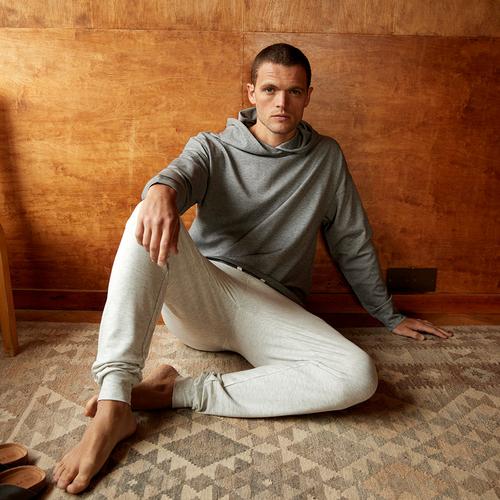 Model wearing a gray hoodie and joggers loungewear set