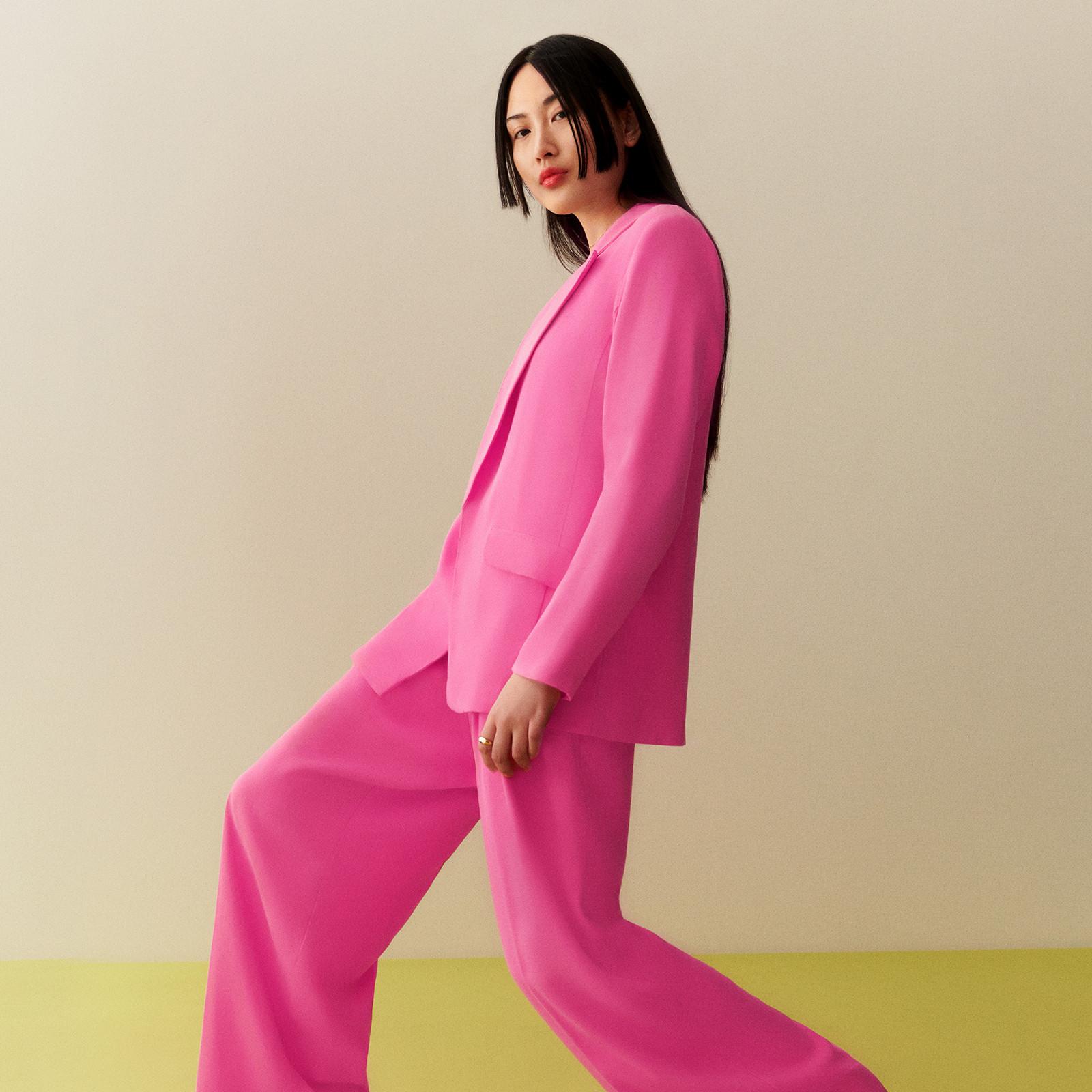 Model wearing a pink suit