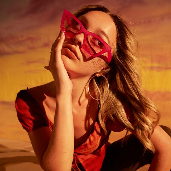 Model wearing red sunglasses