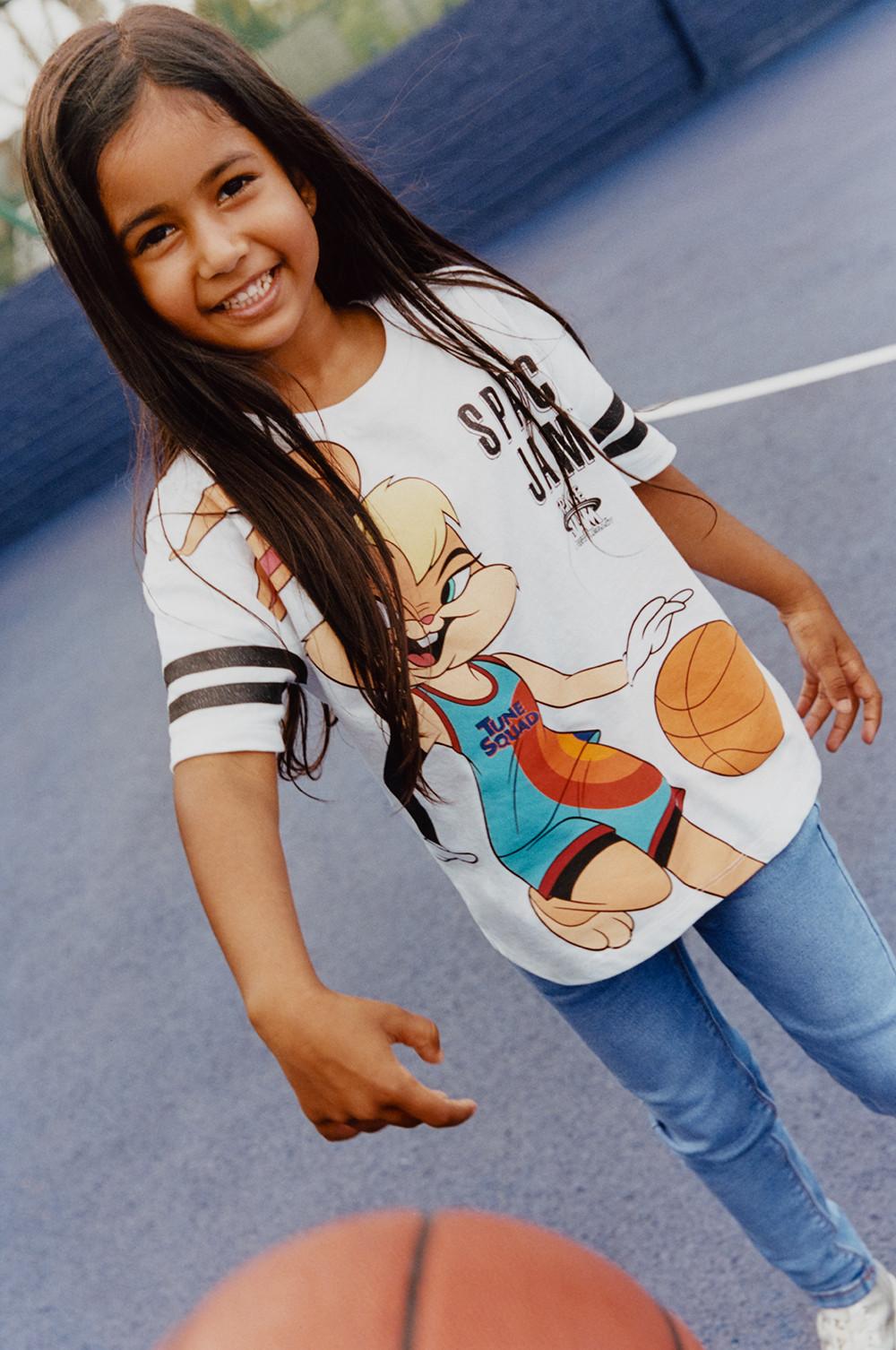 Model wearing White Space Jam Basketball T-shirt