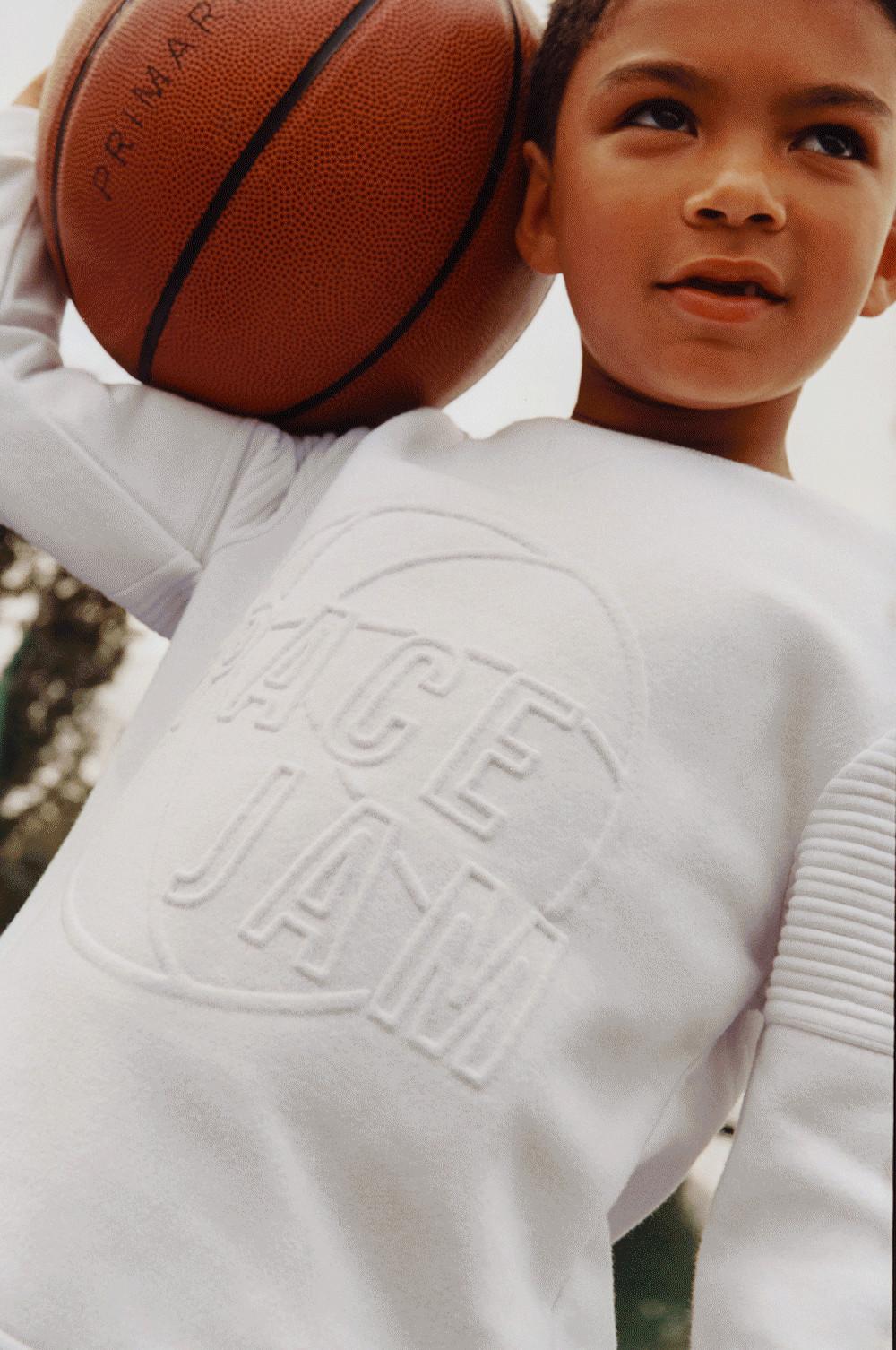 Model wearing White Space Jam Sweatshirt