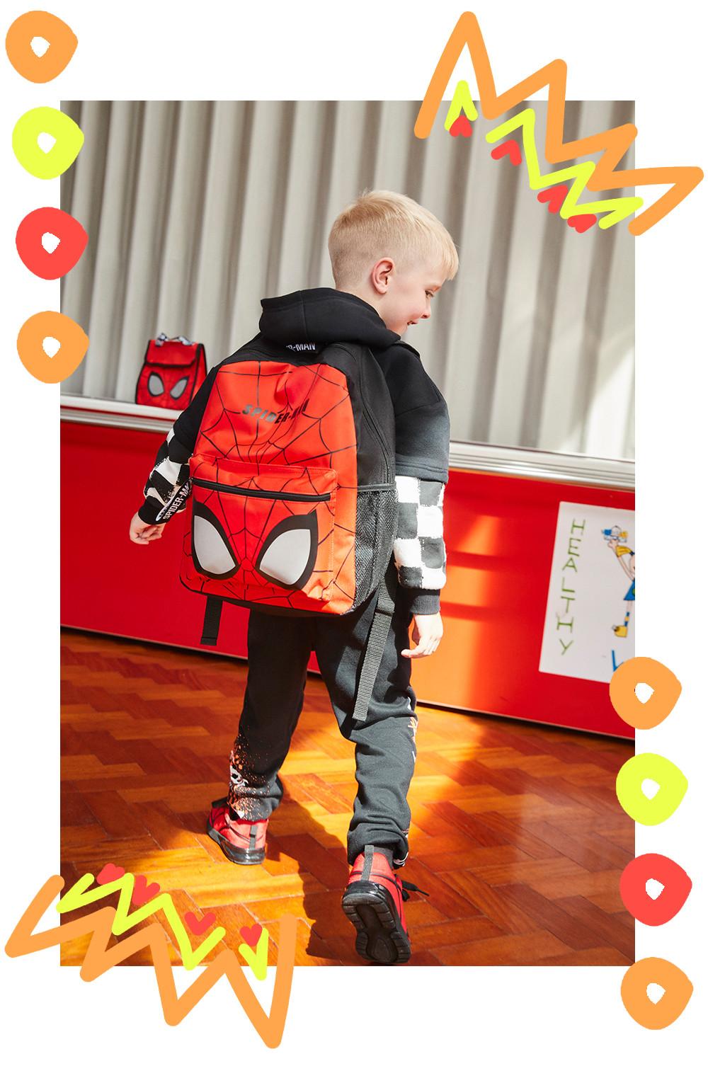 Child wears Spiderman Backpack
