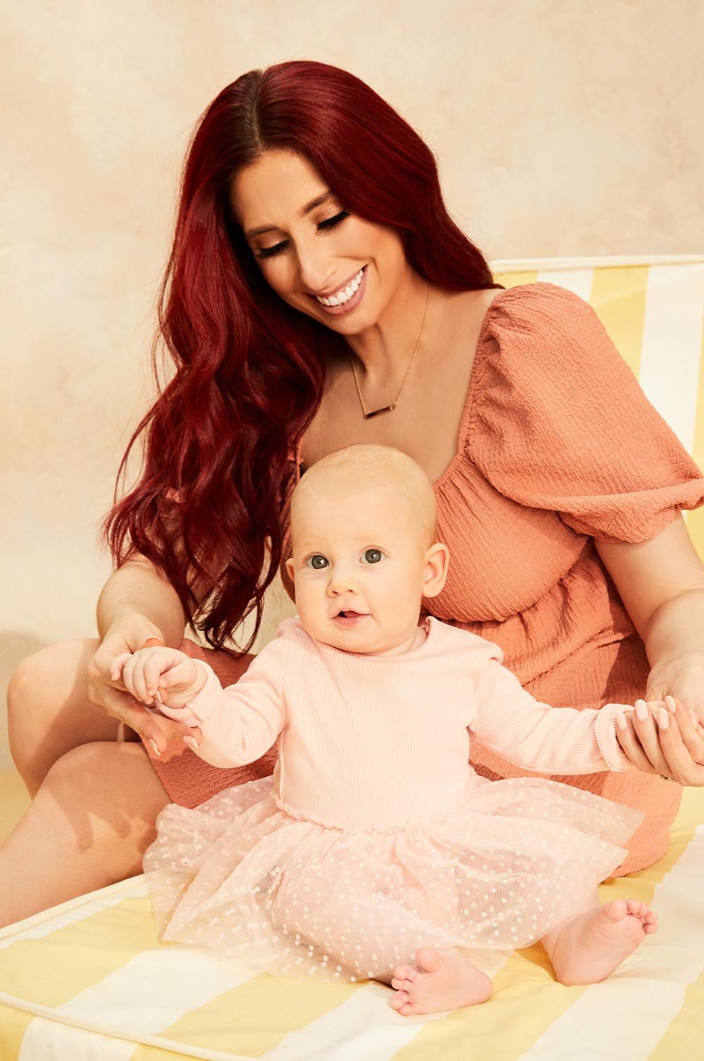 Stacey with her daughter in a pink tutu bodysuit