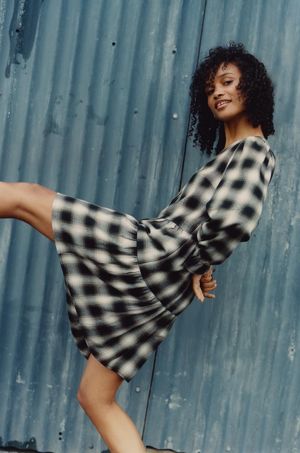 Model wearing Black Check Tiered Dress