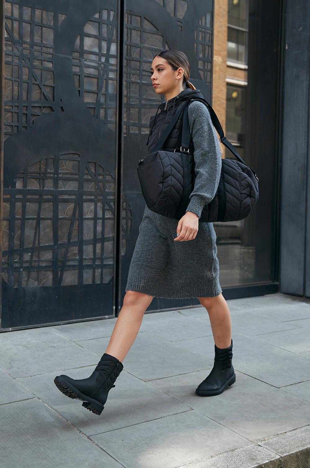 Model wearing black Black Quilted Bag