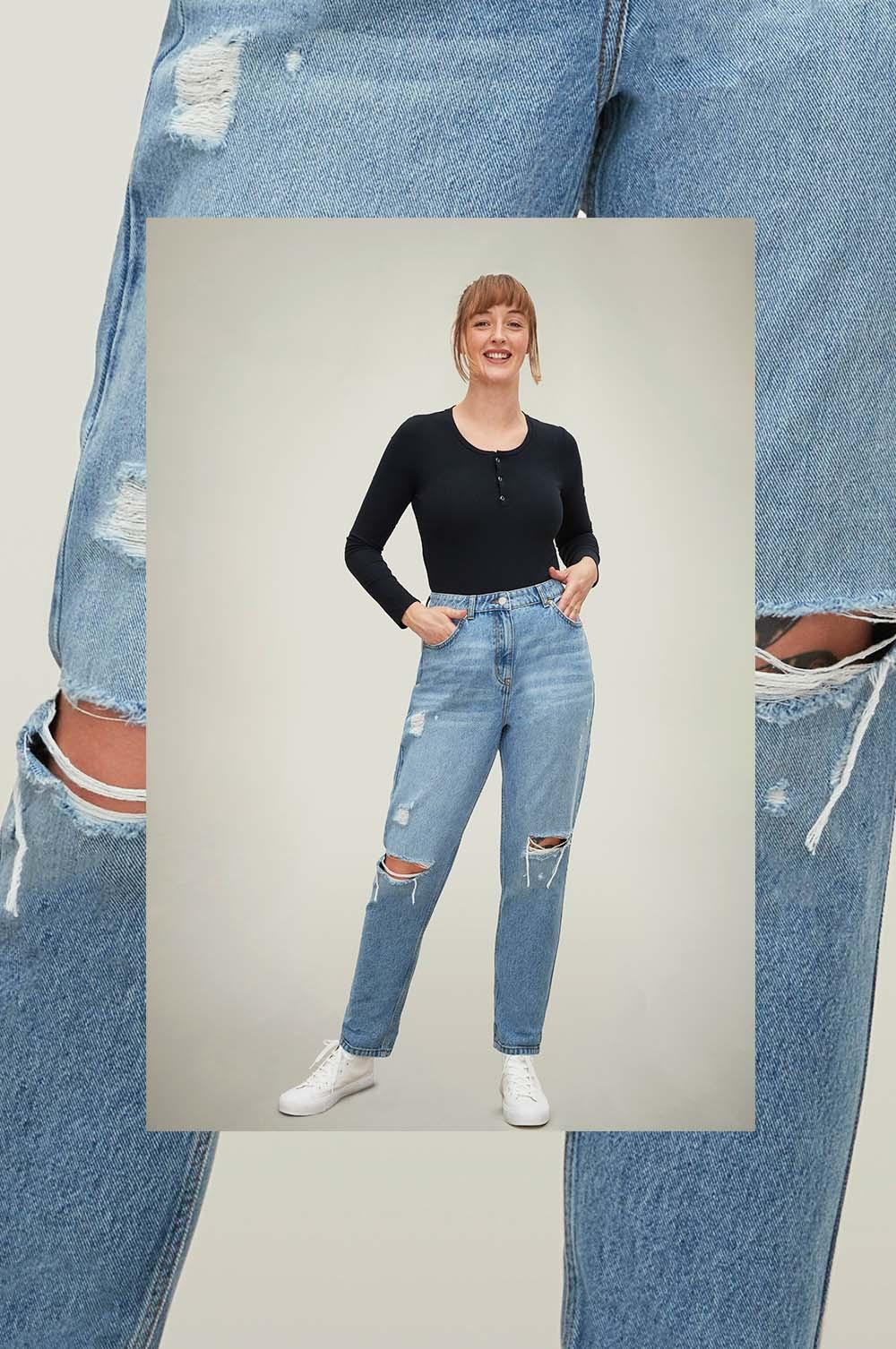 Model wears ripped vintage mom jeans