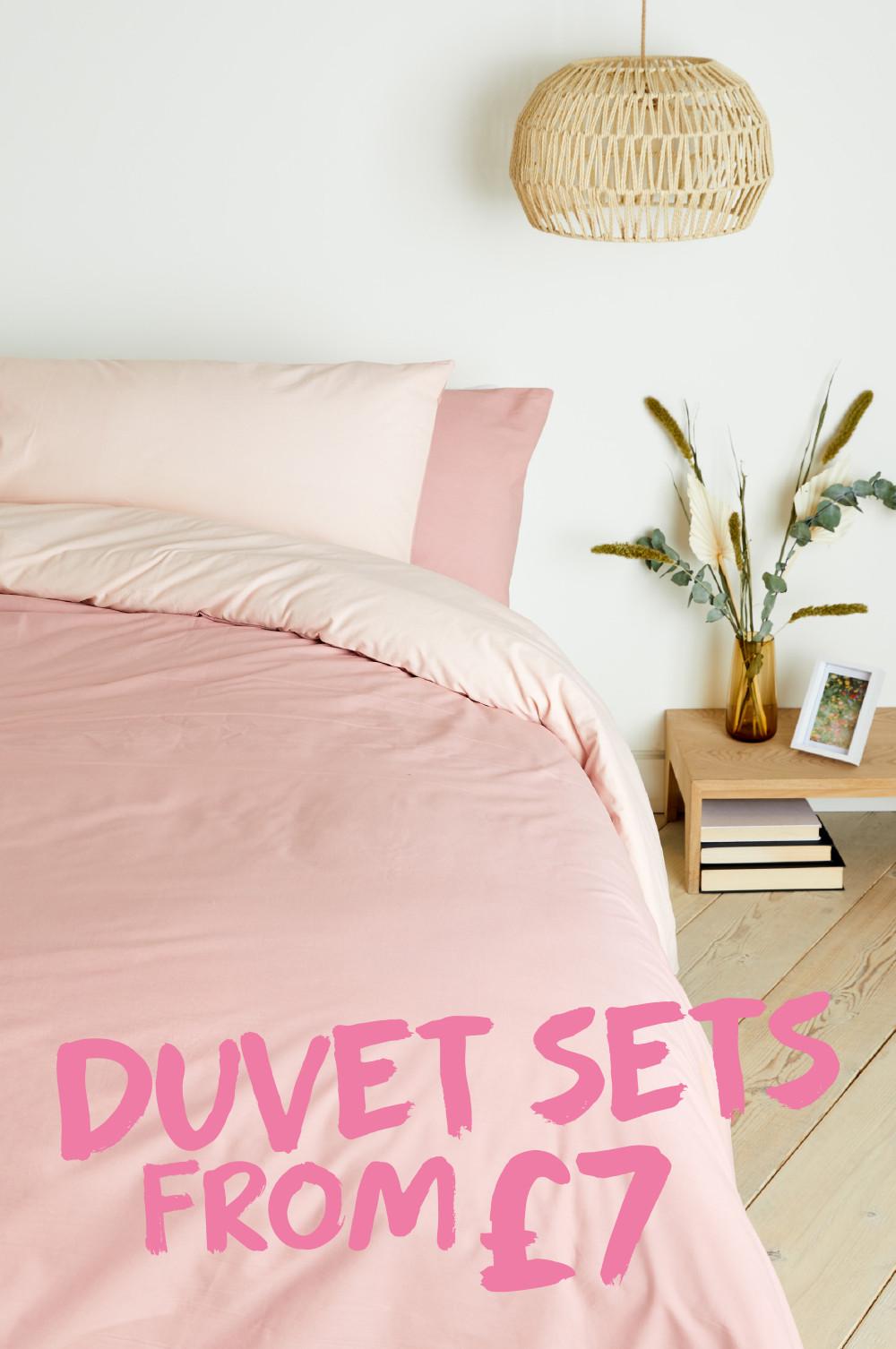 Bed with pink duvet cover