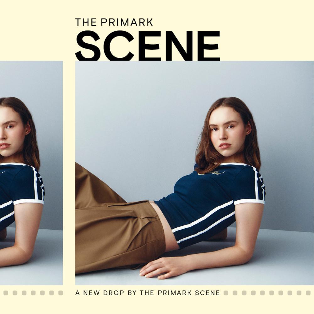 Fashion advertisement featuring navy striped top and brown trousers from Primark Scene collection.