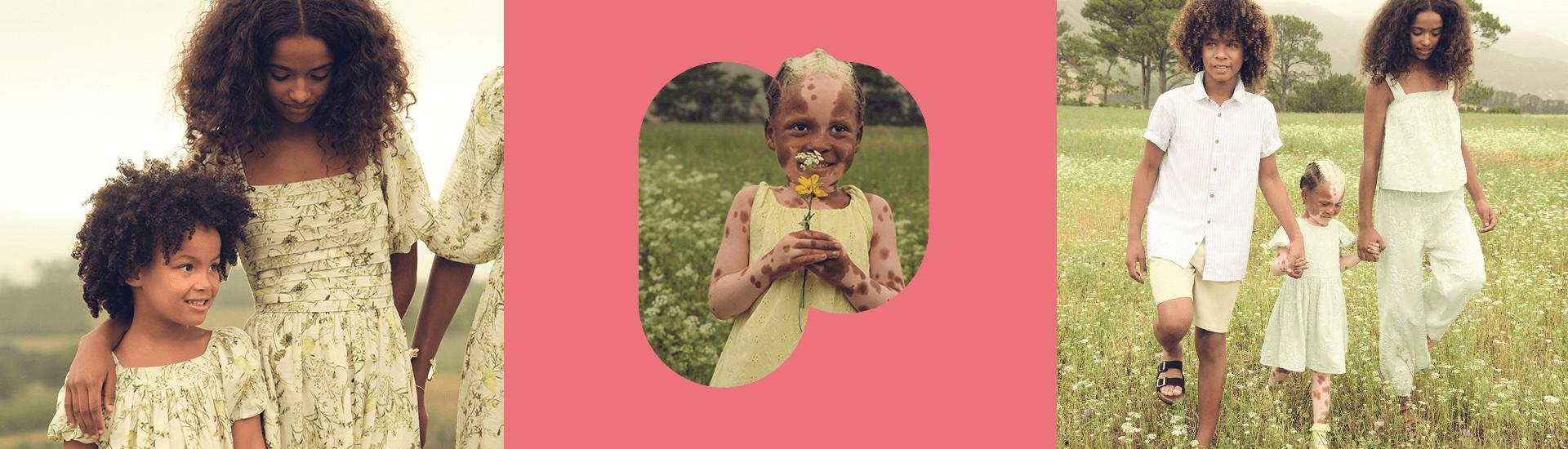 Kinderen in bijpassende lichtgekleurde outfits lopen op een zomerdag door een bloemenweide.