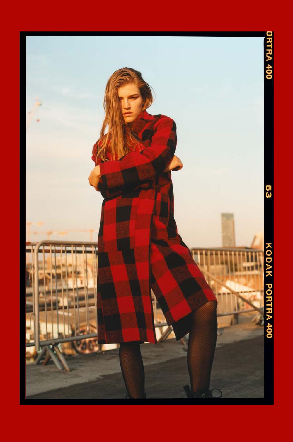 Model in red check Primark coat