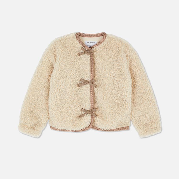 Primark cream teddy jacket with brown trim and three bow fastenings for children.