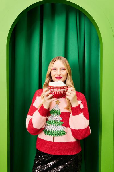 Model in Christmas tree sweater