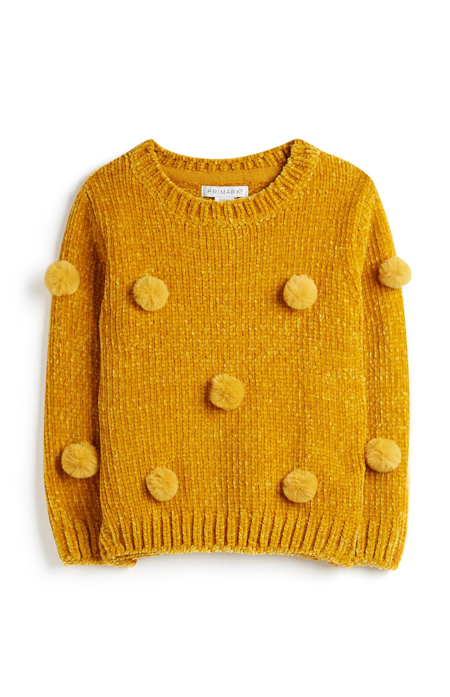 Jersey amarillo con pompones para niña pequeña