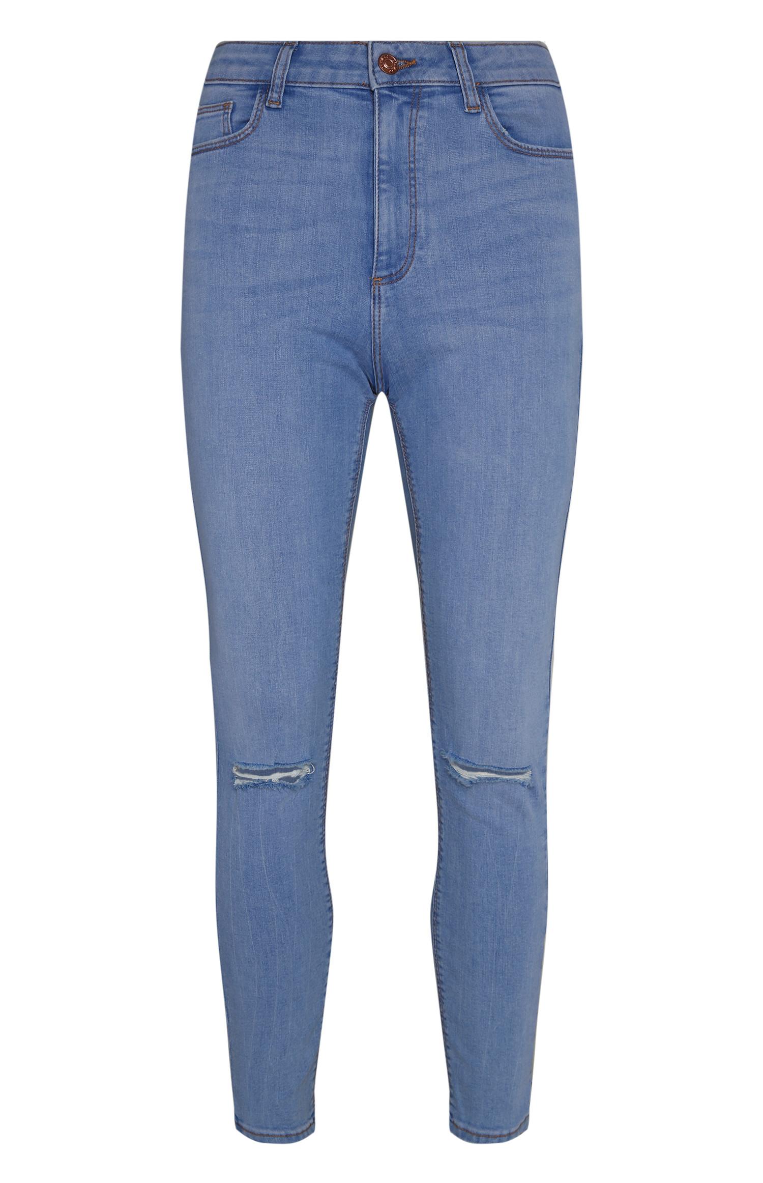 Modre raztrgane oprijete kavbojke