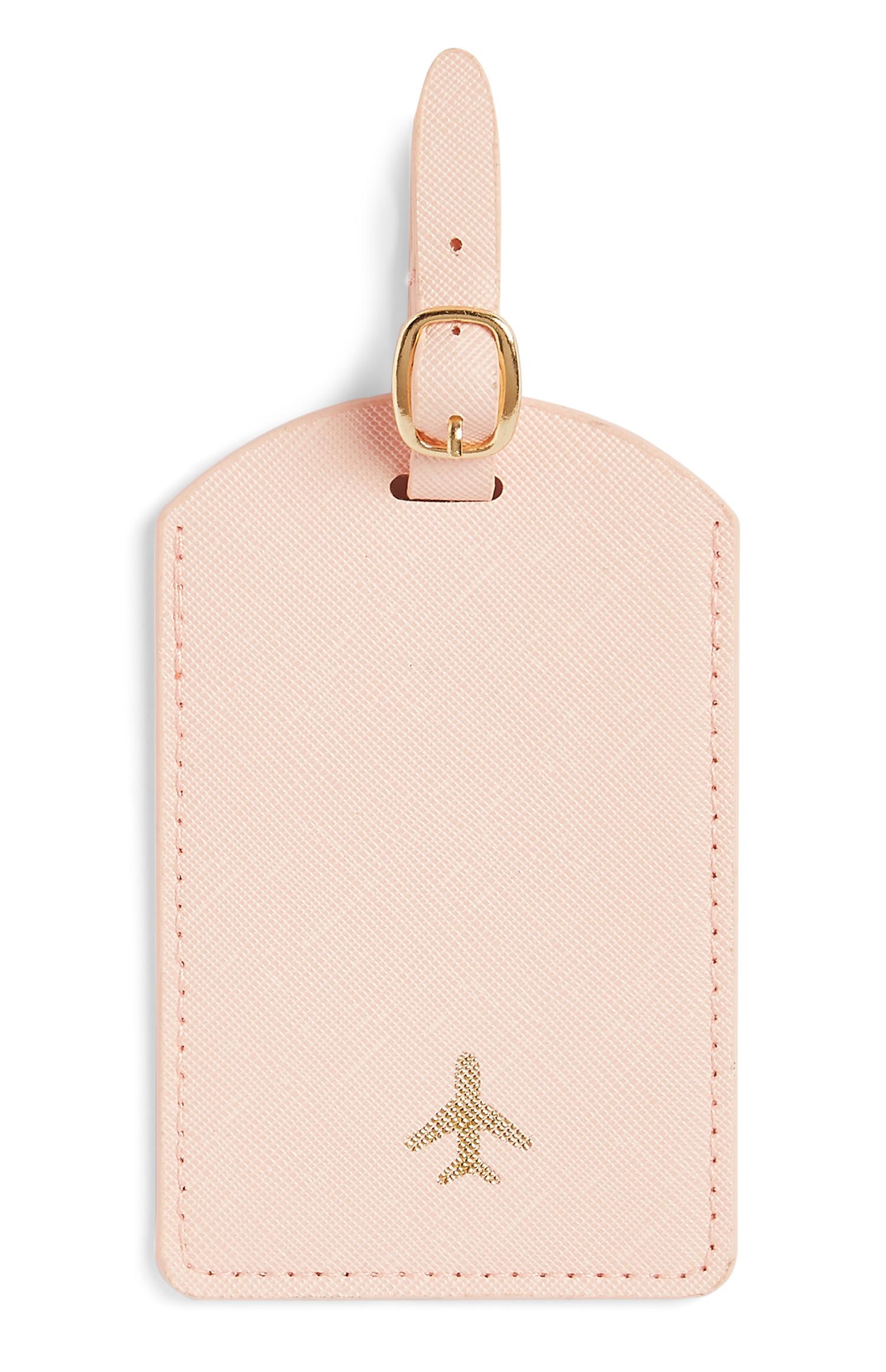 Etiqueta rosa para el equipaje