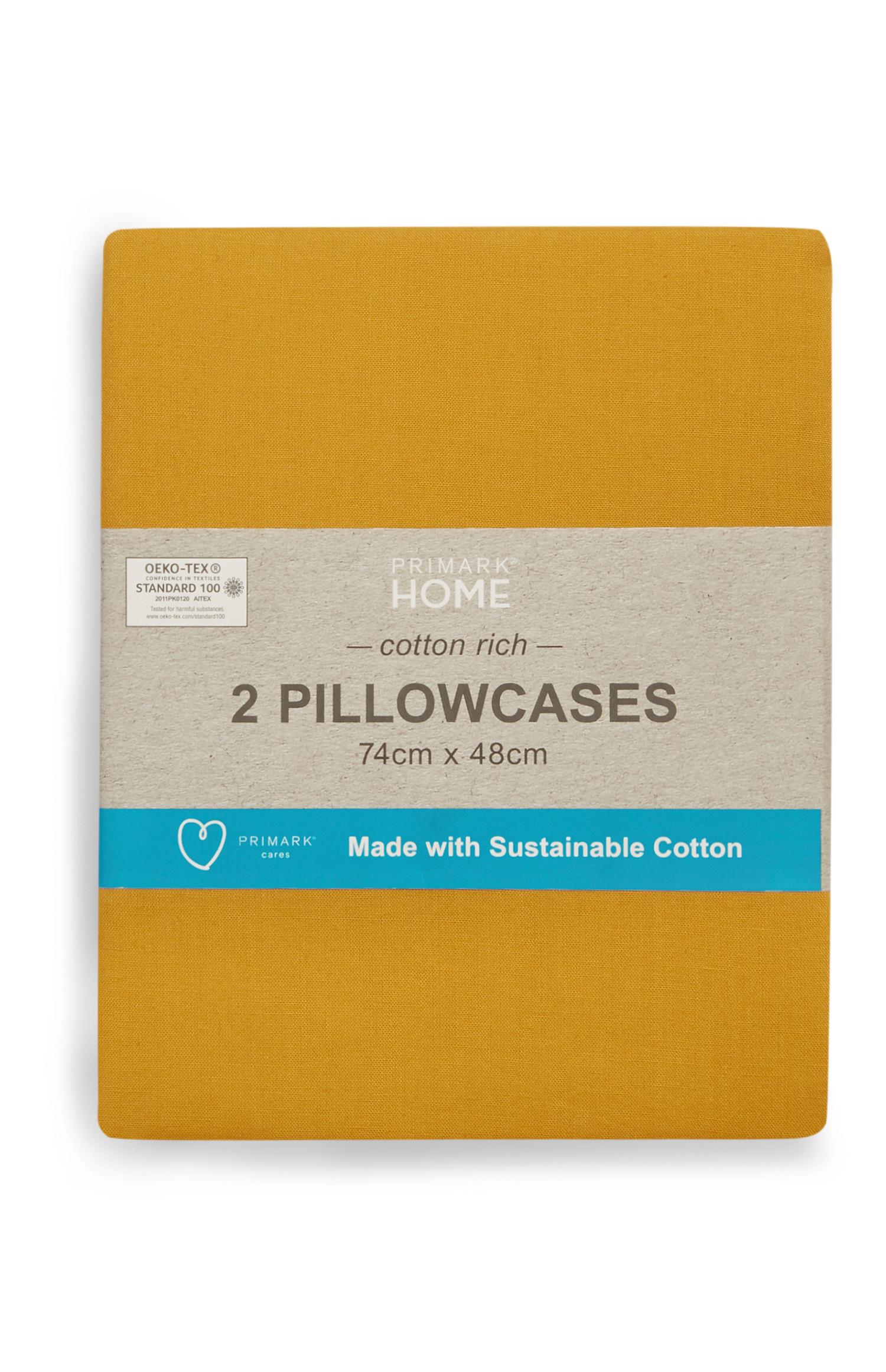 Conjunto de 2 fundas de almohada sostenibles color mostaza