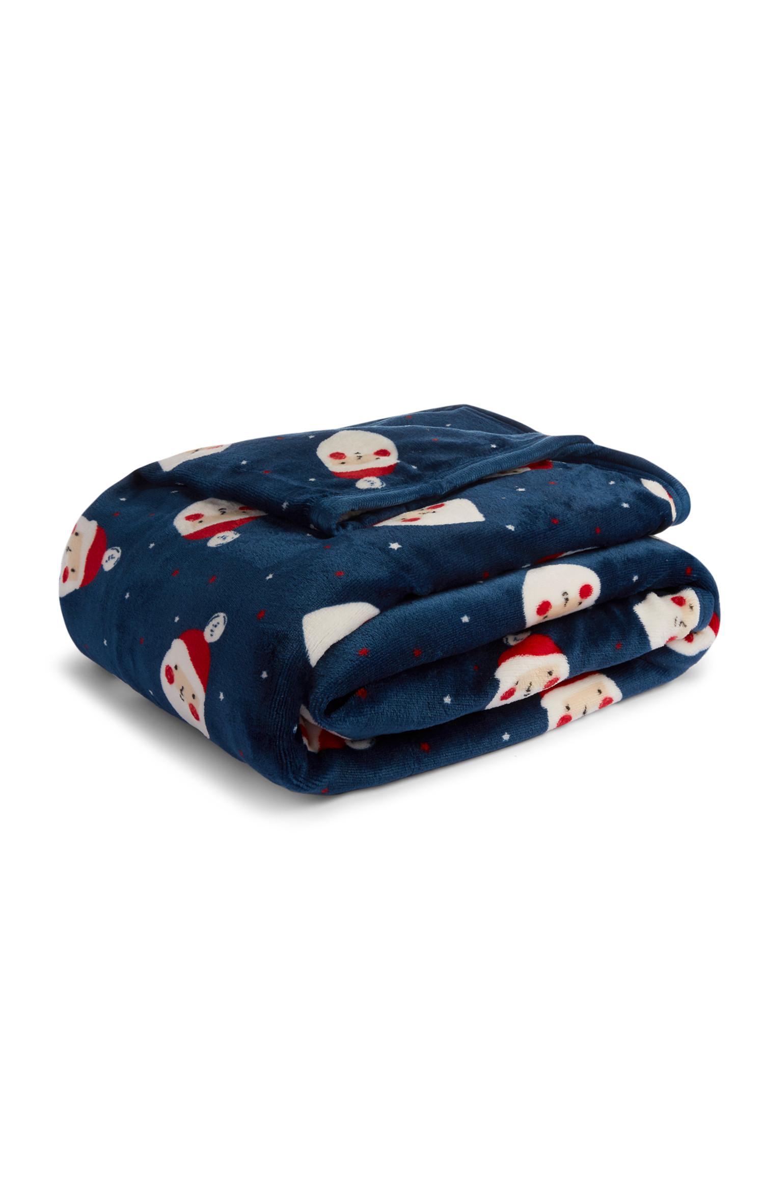 Manta de felpa sintética con motivos pequeños de Papá Noel