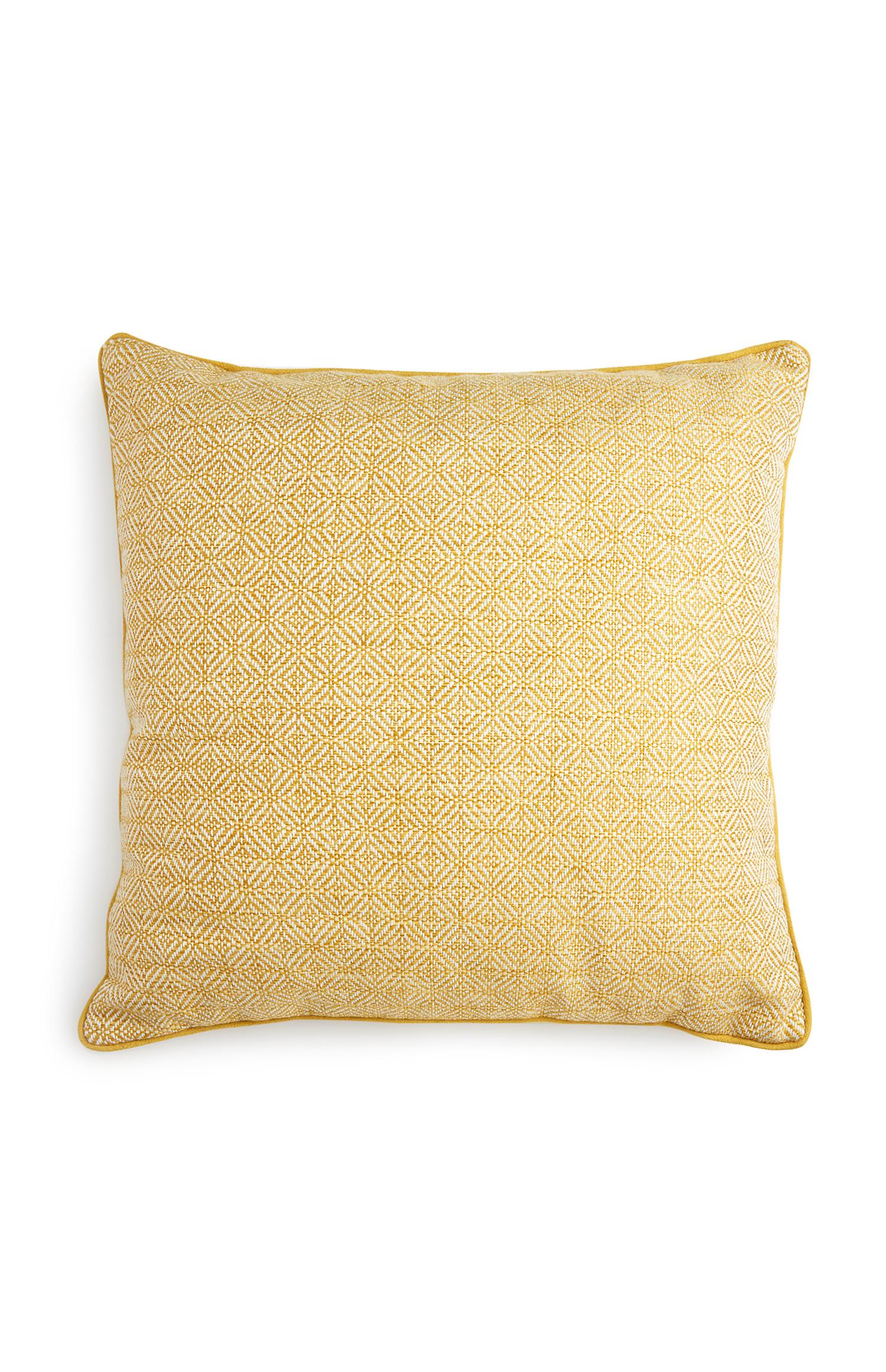 Cojín amarillo con textura