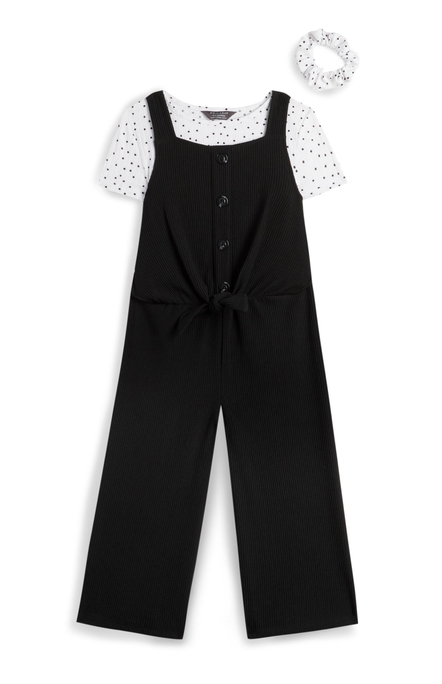 Pichi negro y camisa de lunares con coletero para niña pequeña