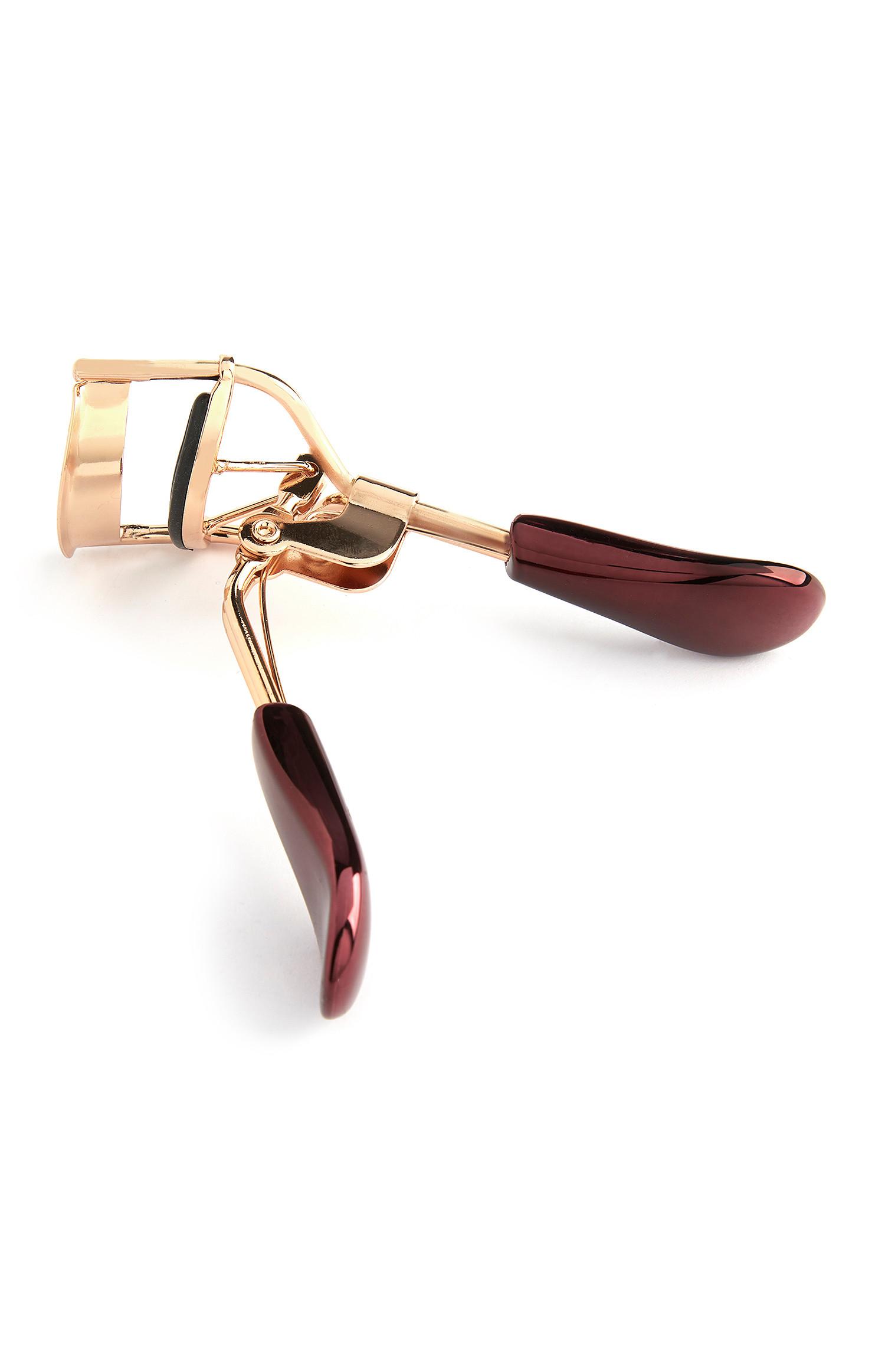 Rizador de pestañas dorado y burdeos