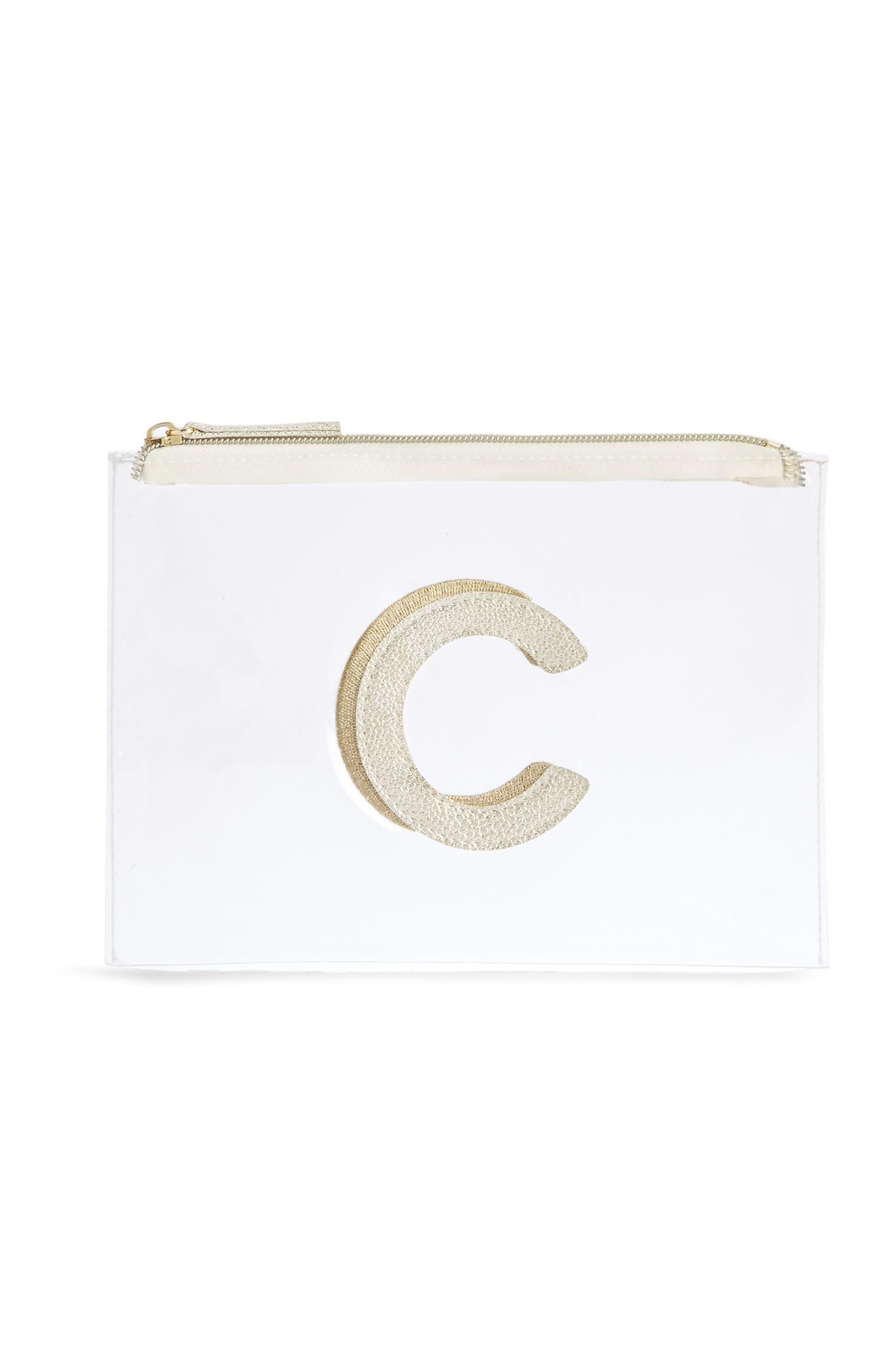 Neceser de maquillaje transparente con la letra «C»