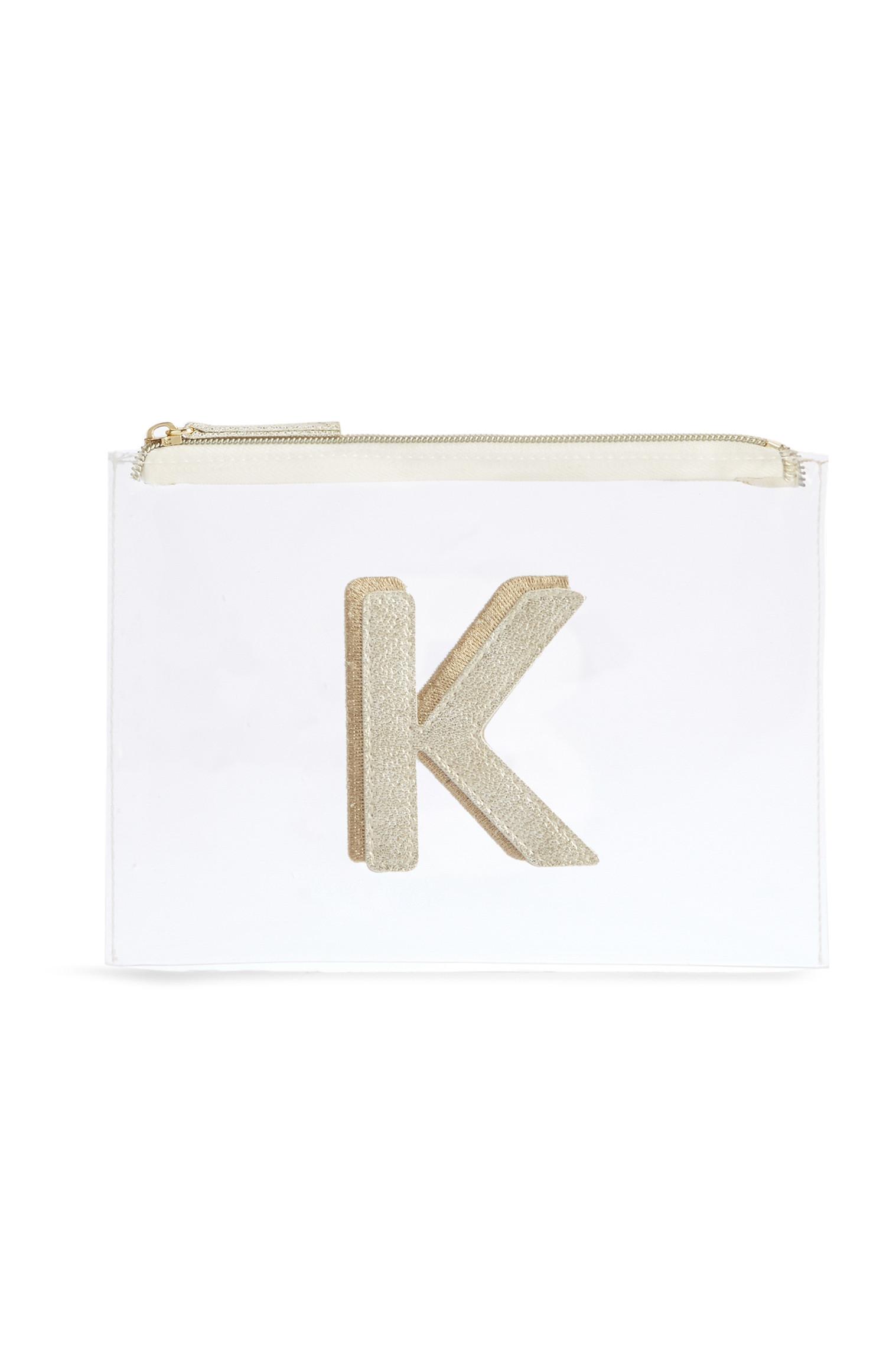 Neceser de maquillaje transparente con la letra «K»