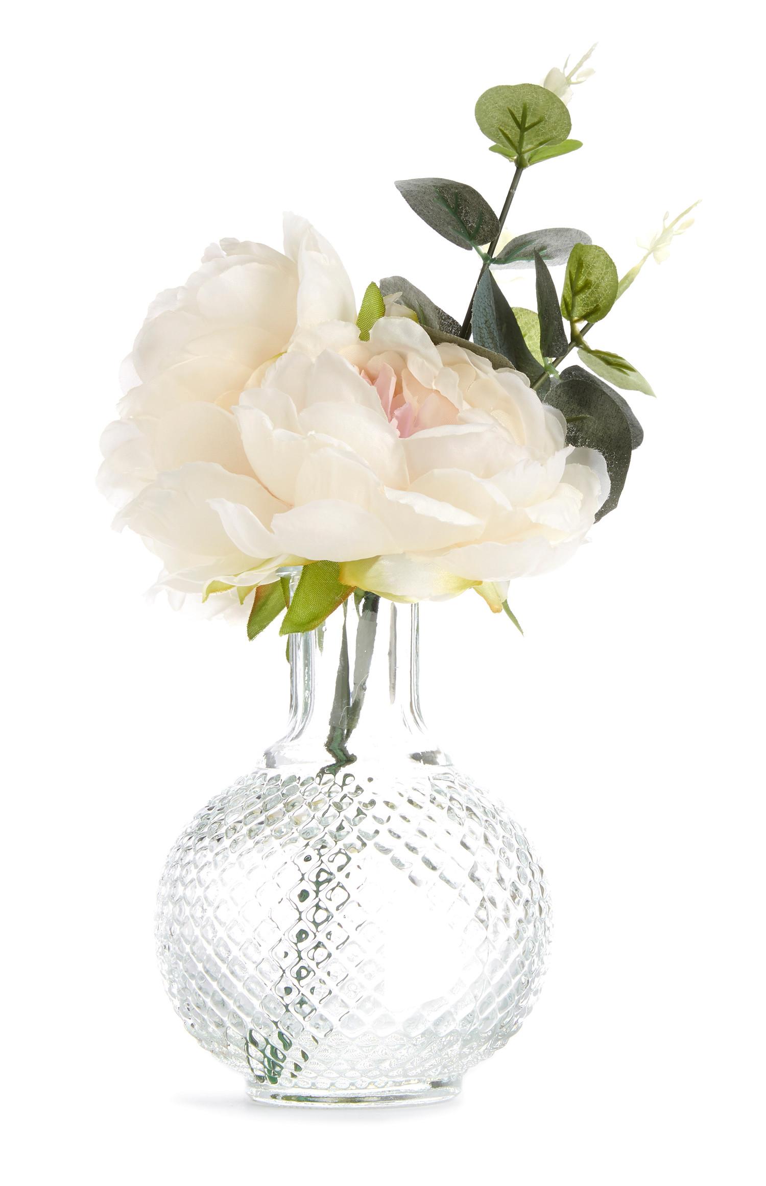 Jarrón texturizado con flores sintéticas