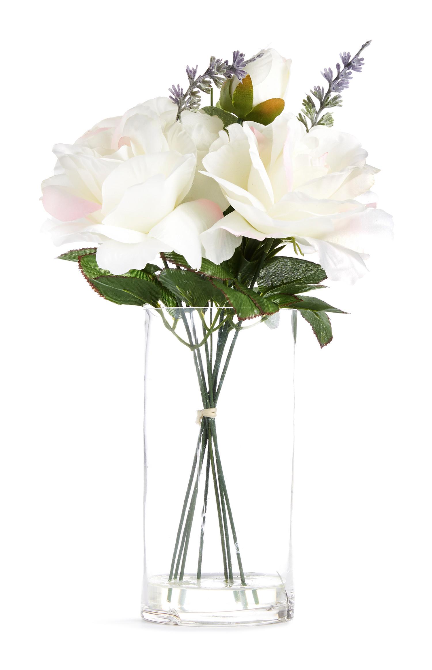 Velika steklena vaza z belimi umetnimi rožami